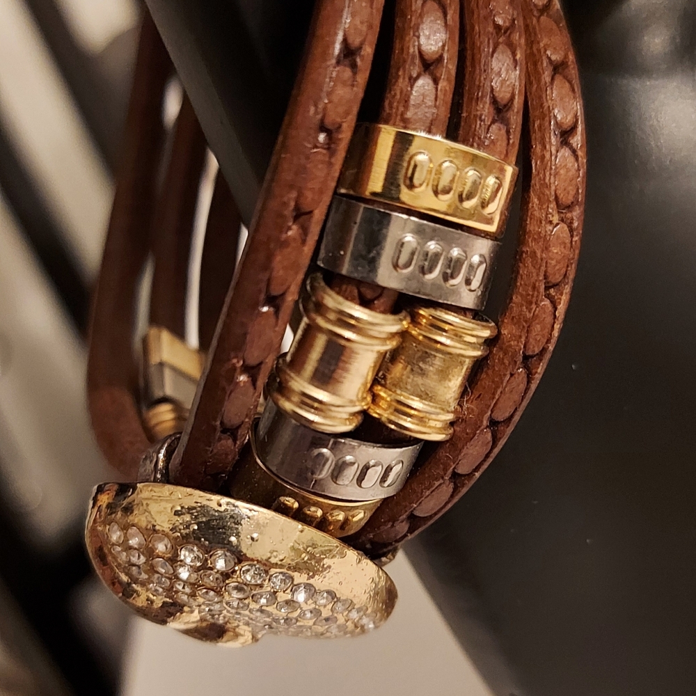 Gold tone metal and leather bracelet